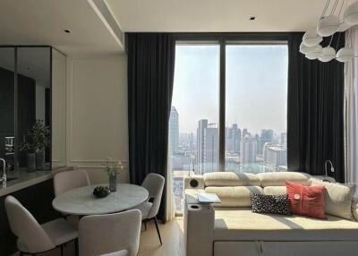 Modern living area with city view, dining space, and stylish decor