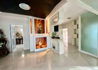 Modern living room with decorative elements and tiled flooring