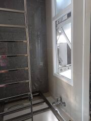 Modern bathroom with towel rack and large window