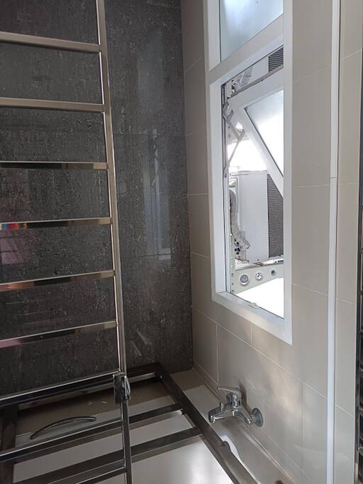 Modern bathroom with towel rack and large window