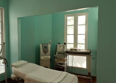 Medical room with treatment bed and medical equipment