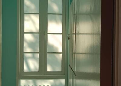 Hallway with window and built-in storage