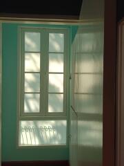 Hallway with window and built-in storage