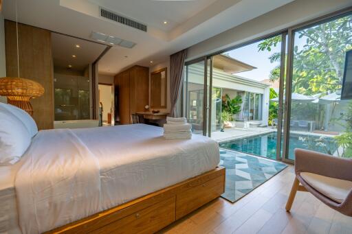 Spacious bedroom with pool view