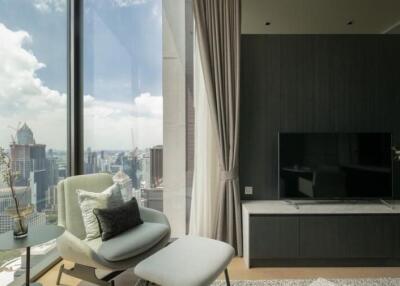 Modern living room with a large window and city view