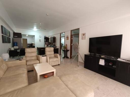 Spacious living room with modern furniture and entertainment setup