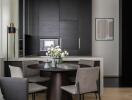 Modern kitchen and dining area with sleek cabinets and a dining table