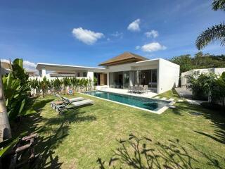 Modern house with a swimming pool and lawn