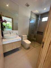 Modern bathroom with shower and vanity