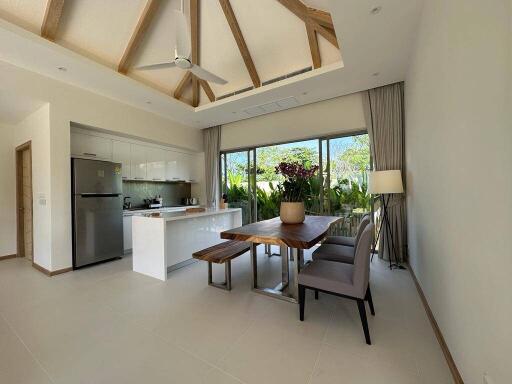 Modern kitchen and dining space with large windows