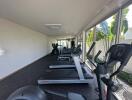 modern indoor gym with multiple treadmills and exercise equipment