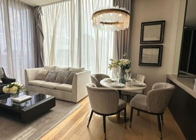 Modern living room with dining area and large windows