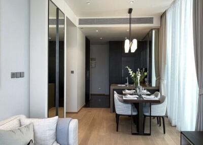 Modern living room and dining area with natural light