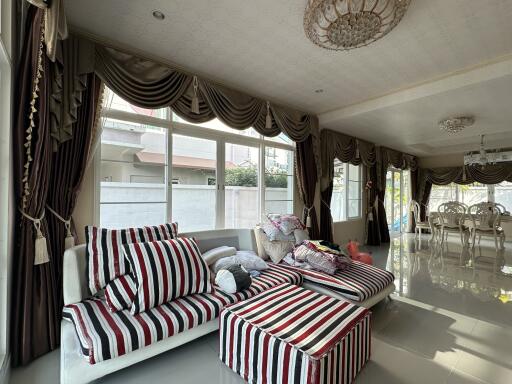 Living room with modern furnishings and glass windows