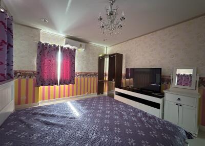 Cozy bedroom with purple-themed decor