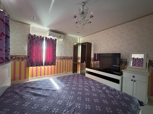 Cozy bedroom with purple-themed decor