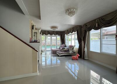 Spacious living room with large windows and modern decor