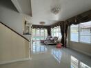 Spacious living room with large windows and modern decor