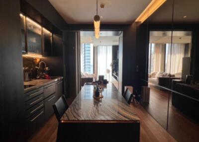 Modern kitchen with dark cabinetry and large island