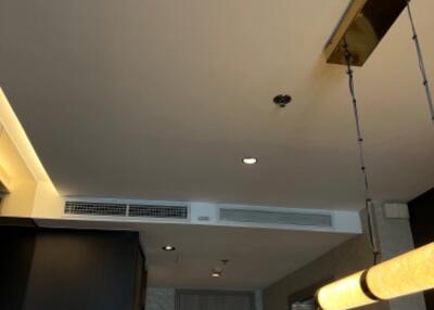 Modern kitchen ceiling with light fixtures and air conditioning vents