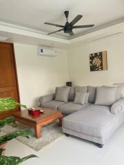 Modern living room with sectional sofa and wooden coffee table