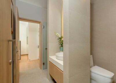 Modern bathroom with neutral tones and contemporary fixtures