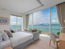 Luxurious bedroom with a panoramic ocean view and modern interior