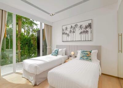 Modern bedroom with twin beds, large window, and outdoor view
