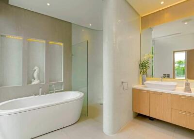 Modern bathroom with bathtub, glass shower, and double sink vanity