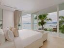 Spacious bedroom with large windows and ocean view