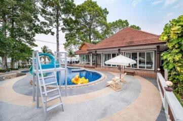 Beautiful backyard with pool and lounging area