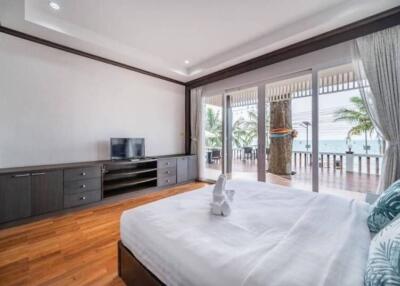 Spacious bedroom with a large window offering a beautiful view