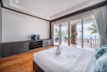 Spacious bedroom with a large window offering a beautiful view