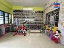 Room with glass cabinets displaying collectibles and a stationary bike