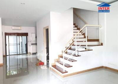 Modern and spacious main living area with staircase