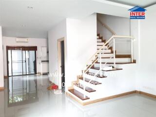 Modern and spacious main living area with staircase