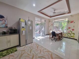 Modern kitchen with natural lighting and dining area