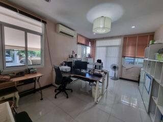 Home office space with desks and shelves