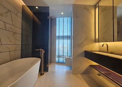 Modern bathroom with bathtub and large window