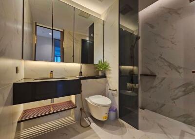 Modern bathroom with large mirror and floating vanity