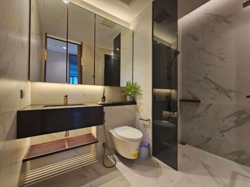 Modern bathroom with large mirror and floating vanity