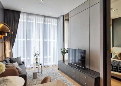Modern living room with adjacent bedroom