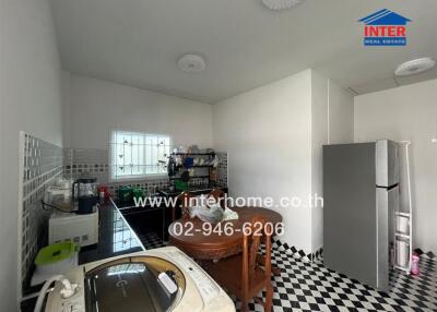 Kitchen with appliances and dining table