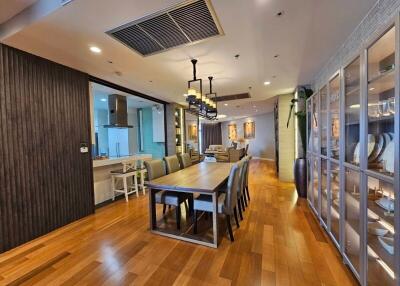 Spacious dining room with a large table and modern decor