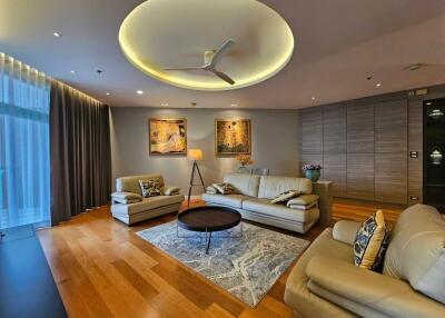 Modern living room with wooden flooring and contemporary furniture