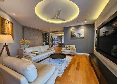 Spacious and modern living room with wooden flooring and stylish furniture