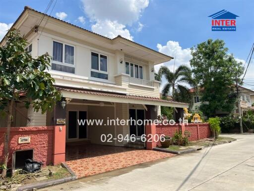 Two-story house with front yard and driveway