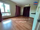 Bedroom with wooden flooring and purple curtains