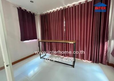 Room with curtains and a table