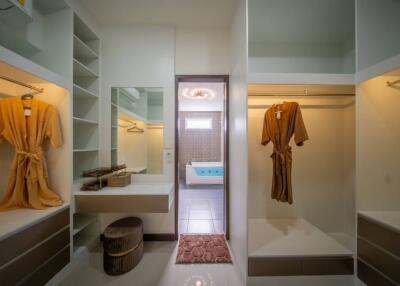Spacious walk-in closet with view of the bathroom